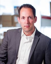 a man in a suit posing for a picture