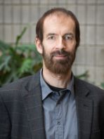 courtesy of BTI. a man in a suit posing for a picture